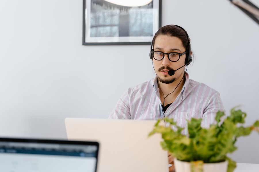 IT support specialist helping a customer over a headset
